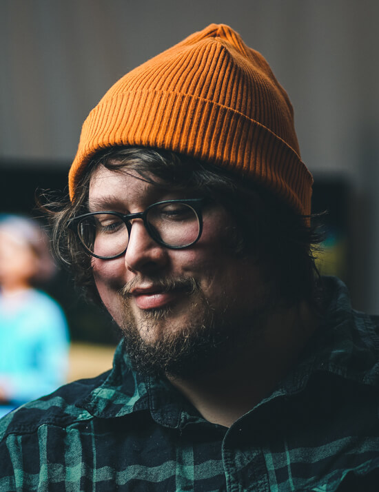 man wearing an orange hat